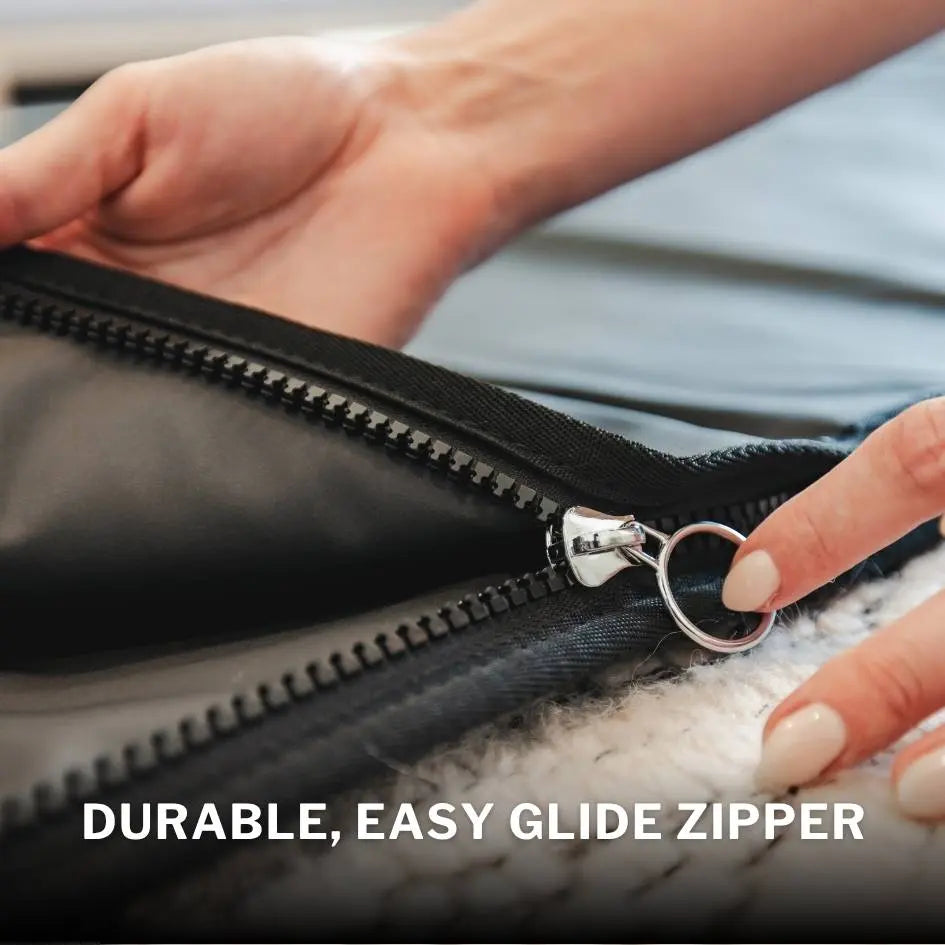 Demonstrating the durable zipper quality.