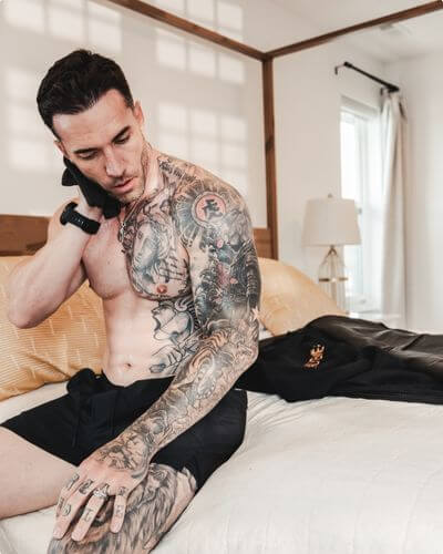 Man post-infrared sauna session sweating and drying off, demonstrating real results, muscle recovery, and the power of infrared heat without gimmicks.