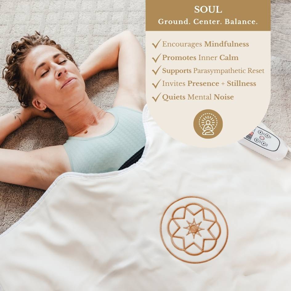 Women relaxing in the white sauna blanket. Words describing the benefits for the soul: ground, center, balance.